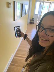 Grace Monjero (on screen) and Sophia Goodin talk on the phone. Grace Monjero (on screen) and Sophia Goodin talk on the phone.
