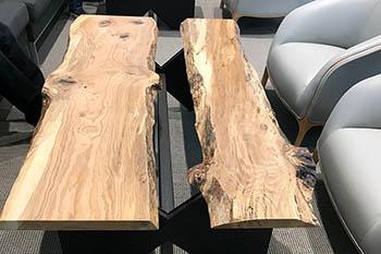The live-edge tables were manufactured by craftsmen and UK students at the UK Wood Utilization Center in Breathitt County. Photo by Chad Niman