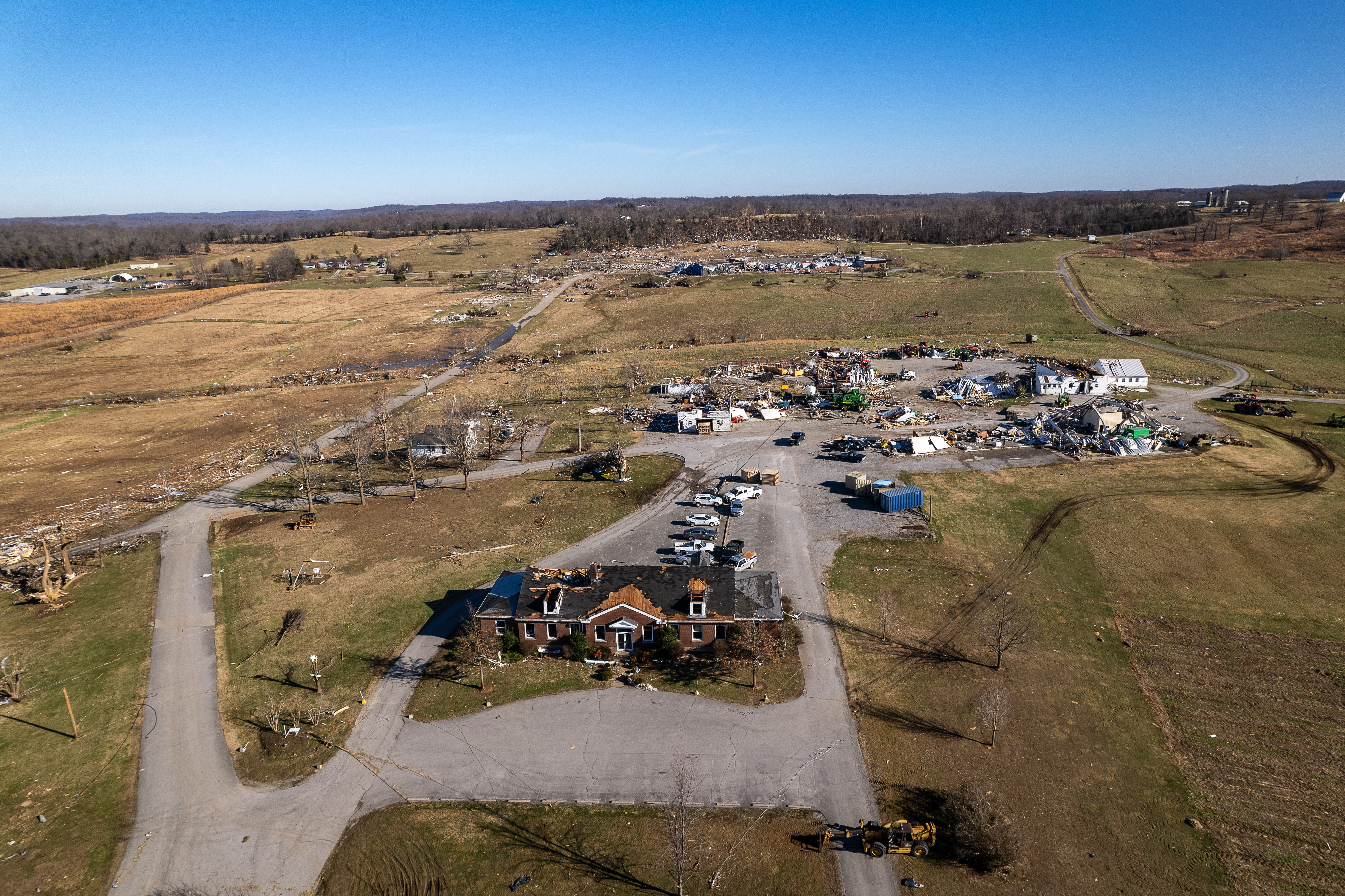 Tornado damage to the UK Research and Education Center. Historical first substation building is in the foreground followed by what was the equipment facilities and the UK Grain and Forage Center of Excellence in the background.