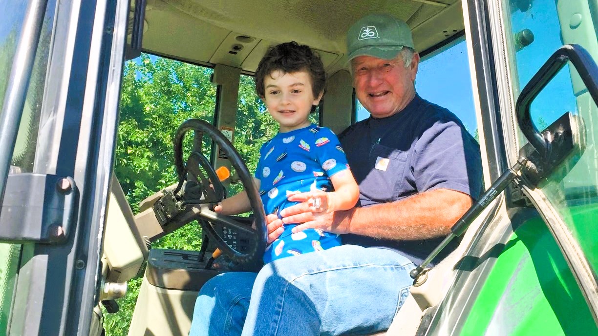 David Jacobs, pictured with grandson and owner of Jacobs Farm, will provide a $5,000 matching gift on One Day for UK. Photo provided by David Jacobs.