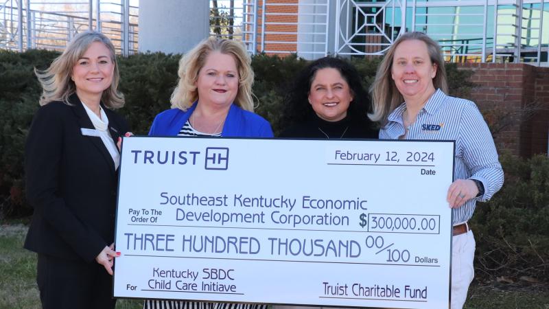 The Truist Charitable Trust Fund's additional $300,000 grant will help provide more childcare resources for certain households. Pictured left to right: Jennifer Leach, Truist; Michelle Spriggs, Kentucky SBDC (Eastern KY); Scarlett Consalvi, Kentucky SBDC and Amanda Kelly, SKED. Picture provided by SKED.