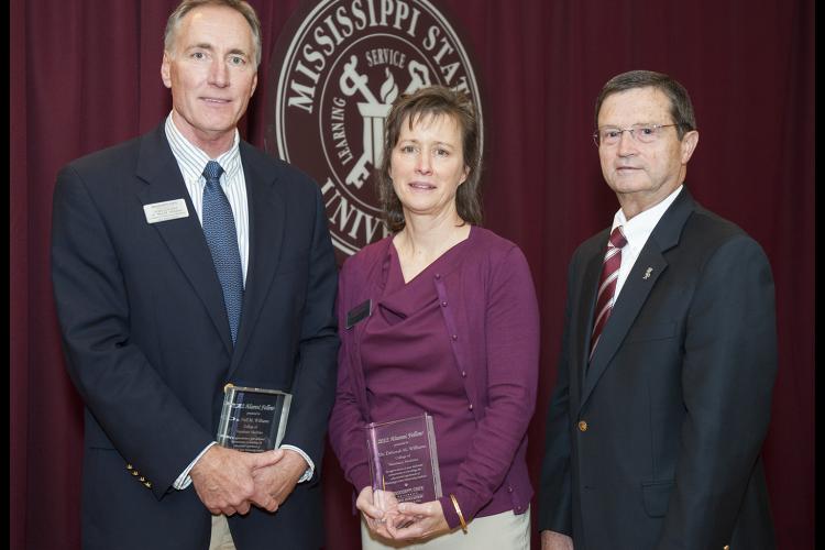 Dr. Neil M. Williams, left, and his wife Dr. Deborah Maples Williams, with Kent Hoblet, dean of the MSU College of Veterinary Me 
