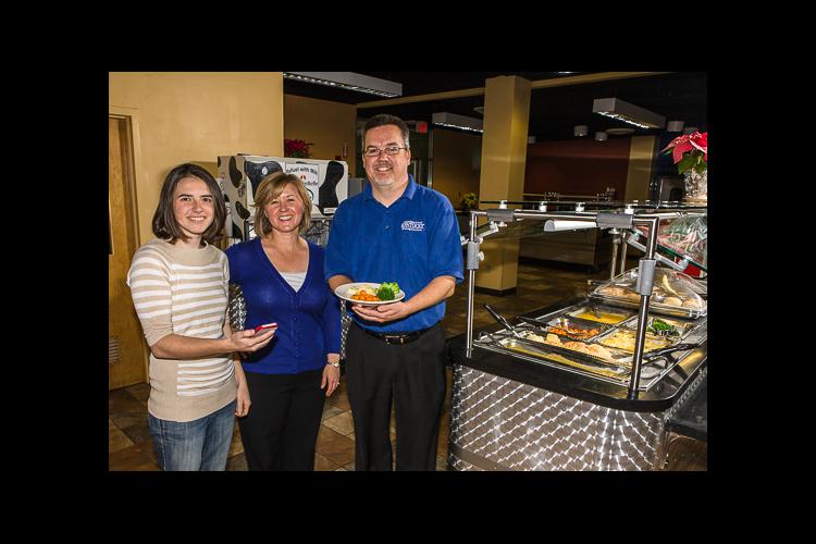 From left Mallory Foster, Kelly Webber and Ray Schmidt in one of the on-campus eateries featured on the UK Food app. 