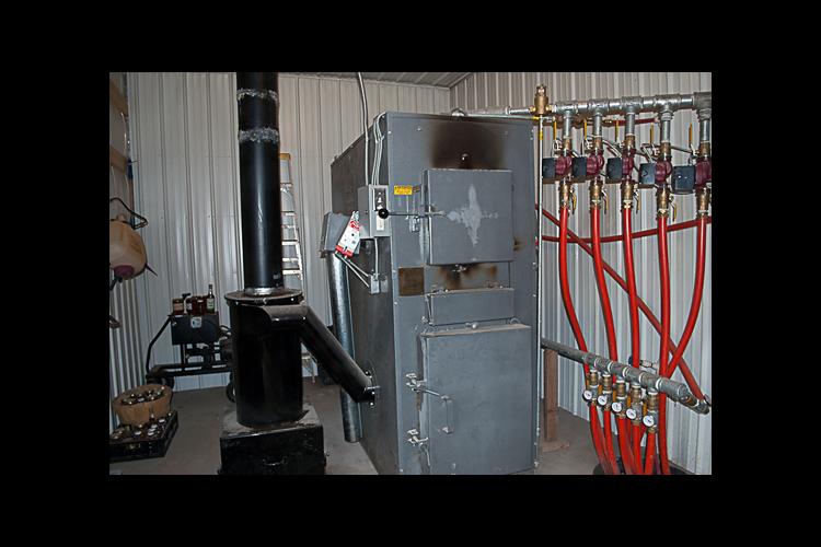 Hart County farmer Paul Dennison installed this biomass gasification boiler to improve his energy efficiency earlier this year. 