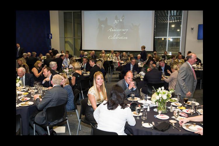 Equine industry representatives attend the UK Gluck Equine Research Center's 30th anniversary celebration dinner. 