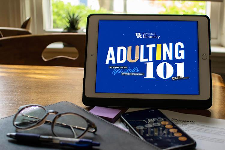 Tablet with Adulting 101 logo on the screen