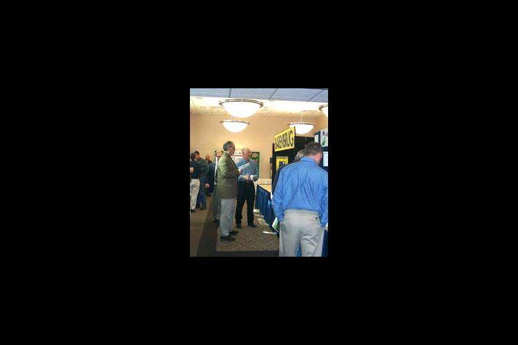 UK Extension Forage Specialist Jimmy Henning talks with visitors at the annual alfalfa conference in Cave City.