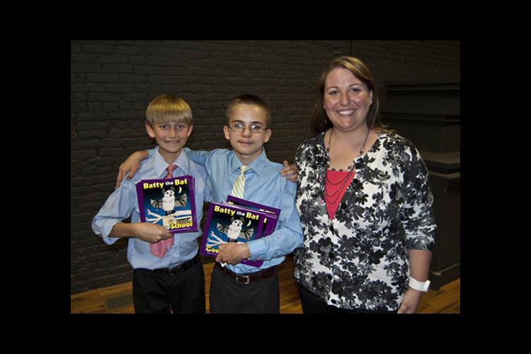 Fifth-grade students Dylan Hood and Isaac Shackleford and their teacher Christina Anderson 