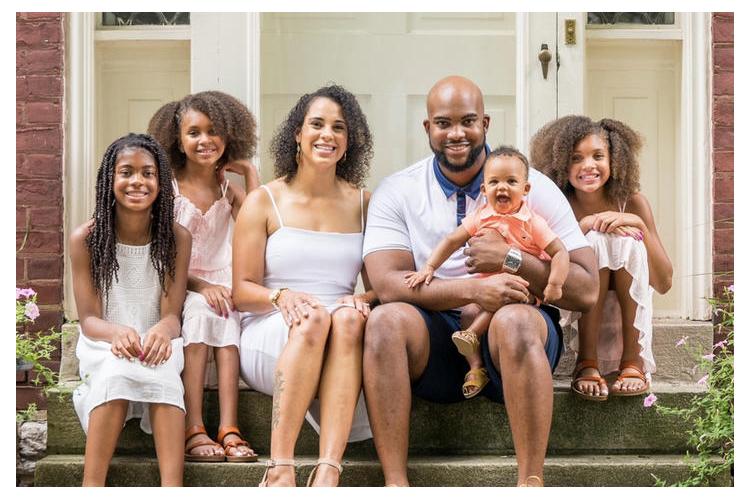 Byron Mitchell (center) pictured with wife Erin D. Mitchell, also a UK grad, and their four children. Photo provided