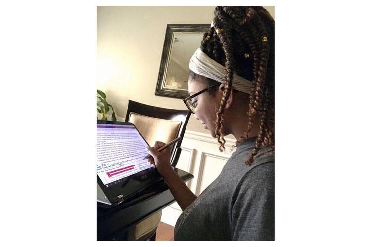 Cheyenne Chandler, UK senior in agricultural and medical biotechnology, analyzes data from her home during her Summer Research Fellowship, following current stay at home ordinances. 