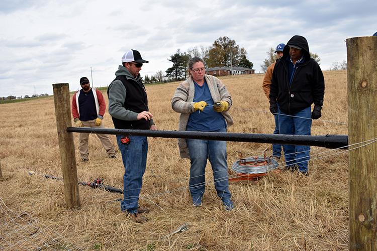 Knox County producer Cheri Gillette learns how to construct a fence for small ruminants from Clay Brewer with Stay-Tuff Fencing. Photo by Katie Pratt, UK agricultural communications.