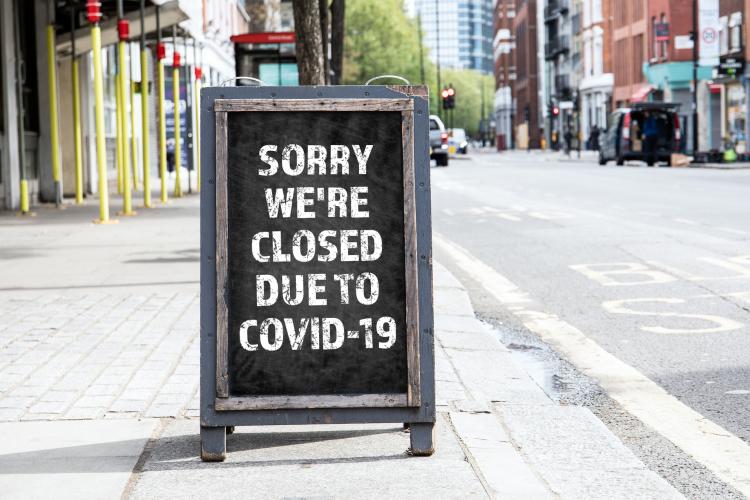 Sign announcing store closing due to COVID-19