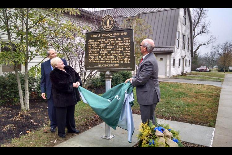 From left, Bob Weldon, Ann Vail and Jimmy Henning unveil the newest historical marker at UK.