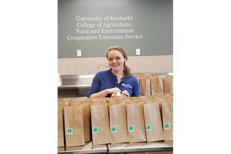 Melissa Schenck, Washington County 4-H youth development agent, prepares Brown Bag Programs in the Washington County Extension office to help families during the pandemic. Photo submitted.