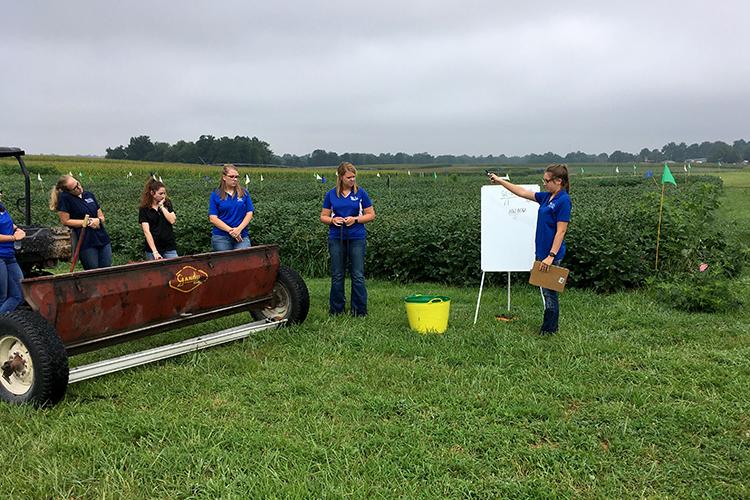 2019 UK intern Hannah York, right, teaches fellow interns from left: McKaylee Copher, Bella Usenza, Gina Merzbacher and Kayla Shelton how to calibrate a Gandy fertilizer spreader. Photo courtesy of Carrie Knott, UKREC director.