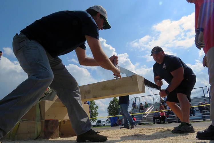 Police and fire teams compete during Lumberjack Games at the 2017 Wood Expo.