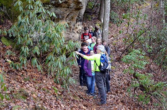 Greg Whitis leads McCreary County seventh-graders on a hike to the Natural Arch. 