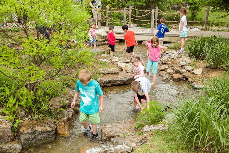 Kids enjoy the Kentucky Children's Garden at The Arboretum on Arbor Day, 2017