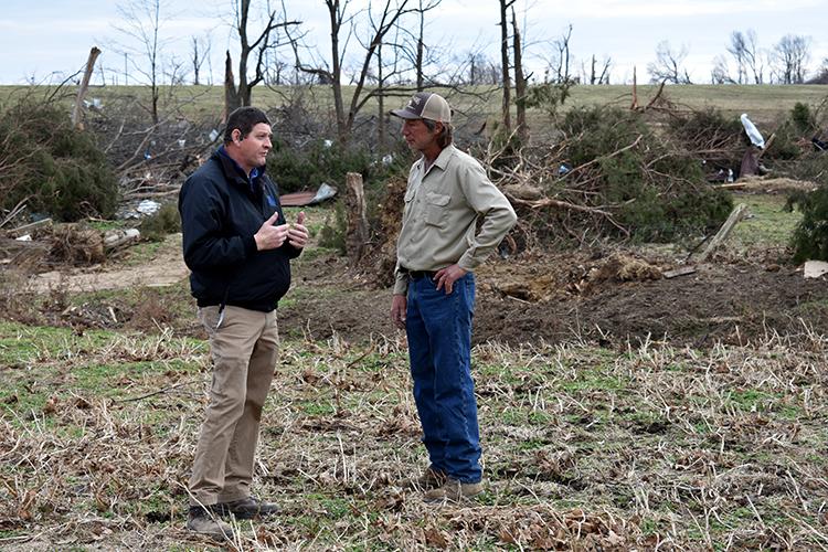 Darrell Simpson, Muhlenberg County agriculture and natural resources extension agent, and livestock producer Kenny Smith discuss the tornado damage to Smith's farm in Bremen. Photo by Katie Pratt, UK agricultural communications. 