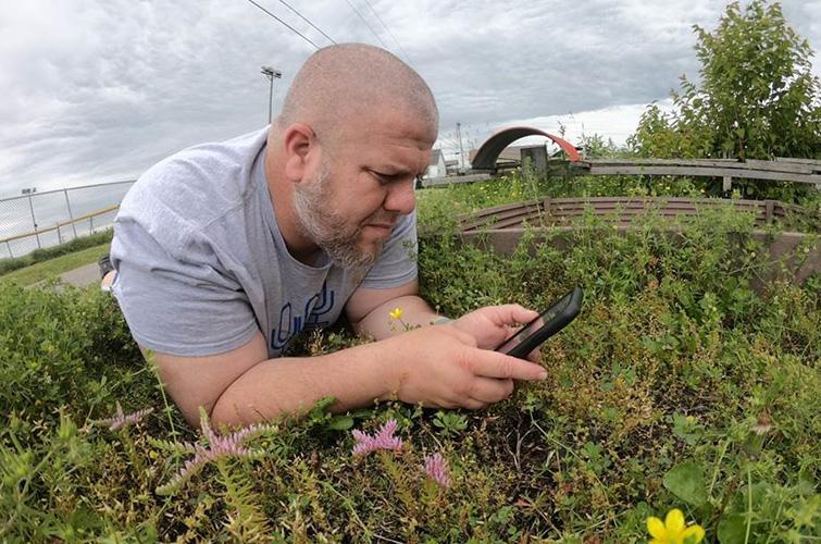 Eric Comley, Garrard County 4-H youth development agent, records a native plant for his YouTube series, "On the Ground." Photo by Eric Comley. 