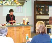 Rosie Allen show participants how to make a healthy fruit crisp.