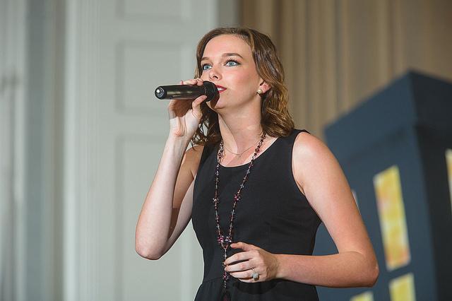 Halie Sawyers sings during a troupe performance. 