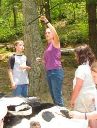 UK Graduate Student Hannah Harris shows local school children how to track bears at Kingdom Come State Park. Photo by A. Nielson