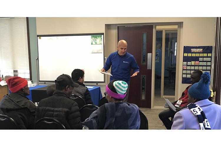 Jefferson County EFNEP assistant Omar Miralles Perez provides an educational program to participants with the Kentucky Refugee Ministries in Louisville. Photo provided by the Kentucky Nutrition Education Program.