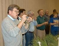 UK Extension Weed Scientist James Martin and participants of the 2000 IPM school identify pests during part of the training session.