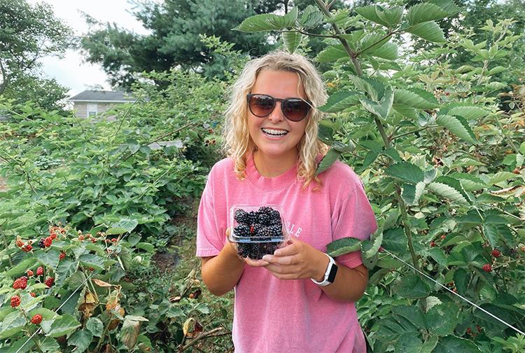 UK student Lucinda Smith, a senior from Corbin, has participated in research and outreach projects that show the health benefits of blackberries to people, who live near Superfund sites. Photo submitted