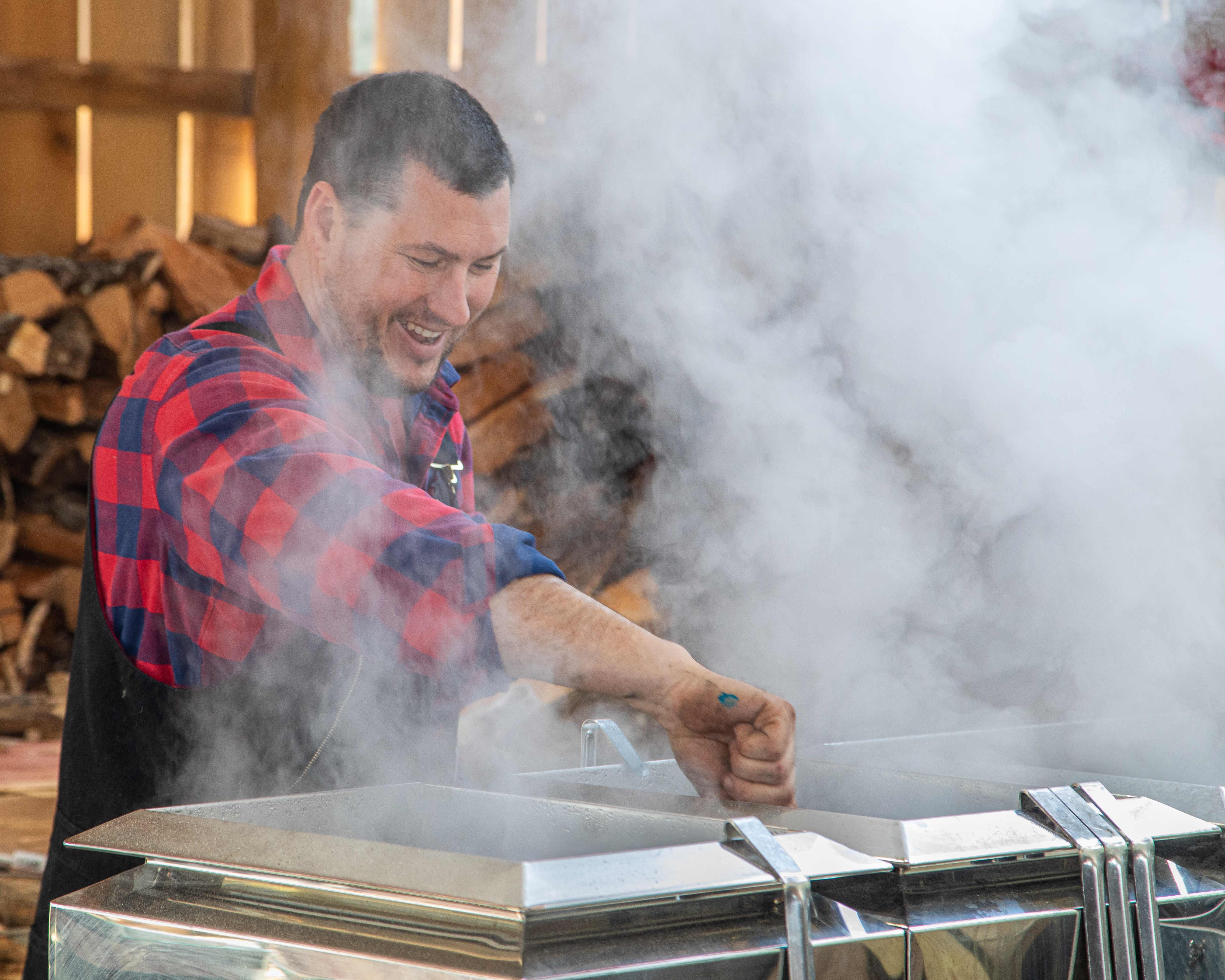 Shawn Hines of Hines East Fork Farm in Edmonton, demonstrates the maple syrup process at Kentucky Maple Day 2021. 