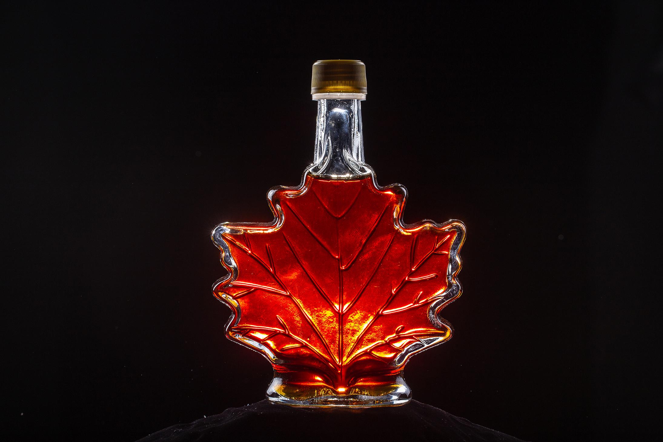 Maple syrup bottle shaped like a maple leaf