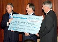 Senator McConnell presents a check to UK President Lee T. Todd, Jr. and UK College of Agriculture Dean Scott Smith. 