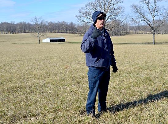 Anderson County producer Mike Wilson talks about his hayfield seeded in novel endophyte tall fescue, which is in the background. 