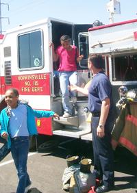 Christian County elementary students check out the inside of a fire engine during Safety Days.