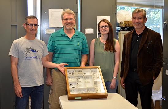 Paul Baker, Eric Chapman, Emily Nadeau and Mike Sharkey display some wasps in Sharkey's lab.. 