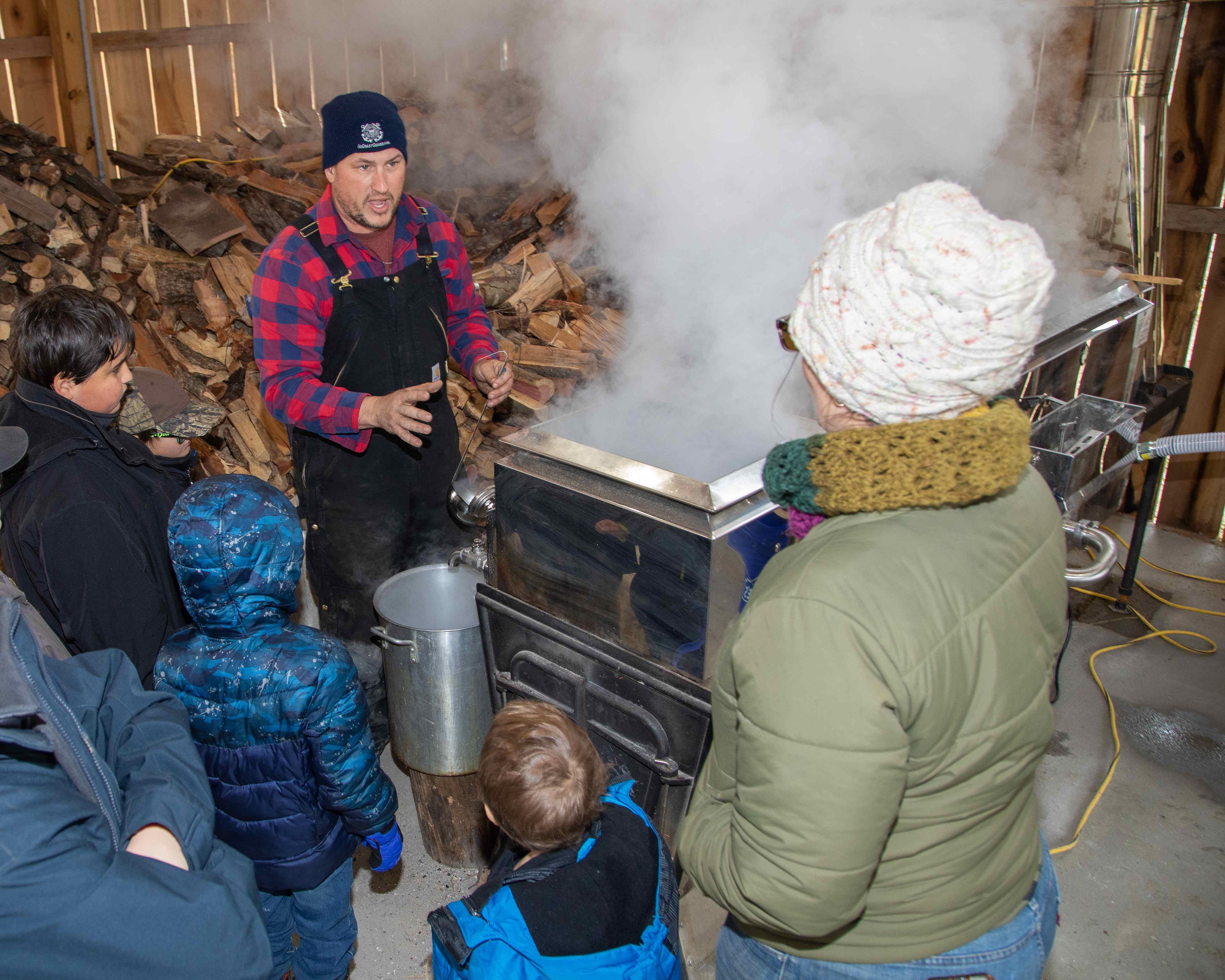 Shawn Hines of Hines East Fork Farm in Edmonton, Ky, shows off his production at the 2021 Kentucky Maple Syrup Day.