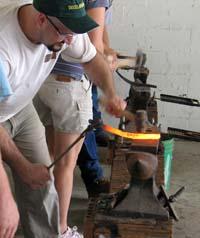 Horseshoeing students shape shoes Horseshoeing students shape shoes