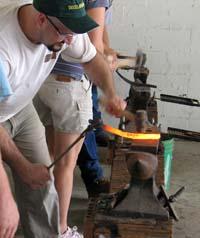 Horseshoeing students shape shoes