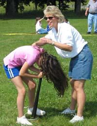 Jennifer Howard helps a student during one of the spin competitions.