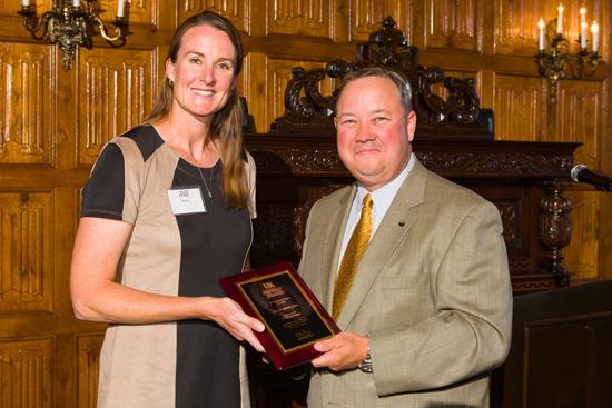 Jill Stowe, left, presents Stuart Brown with the Friend of UK Ag Equine Programs award. 