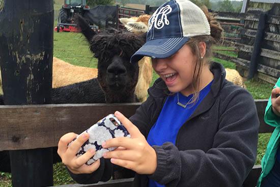 A selfie with an alpaca during Teen Leadership Washington County Agriculture Day. 