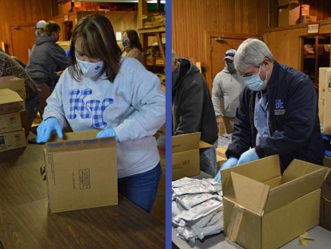 Heather Spencer and Wade Turner pack food boxes at the UK Wood Utilization Center.