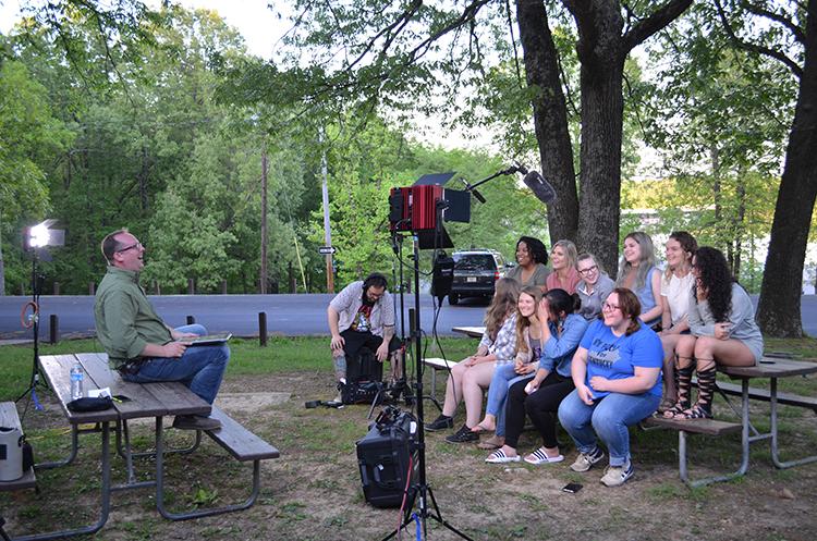 UK associate professor Jason Swanson, left, and UK students recap the day's events on the set of Transformative Travels at Kentucky Dam Village. Photo by Katie Pratt, UK agricultural communications