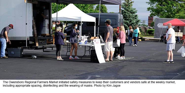 Market day at the Owensboro Regional Farmers Market showing people wearing masks and practicing social distancing