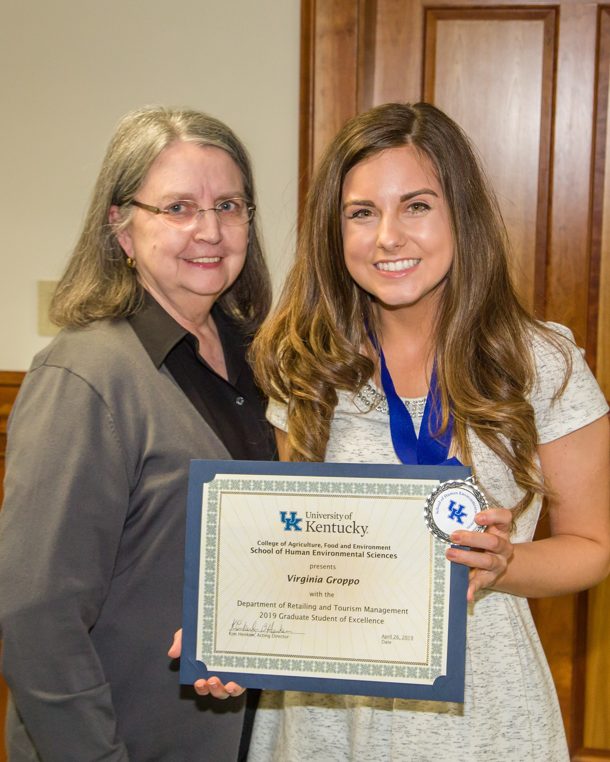 Virginia Groppo receiving the Graduate Student of Excellence award in 2019 from Dr. Elizabeth Easter. Photo courtesy of Viriginia Groppo