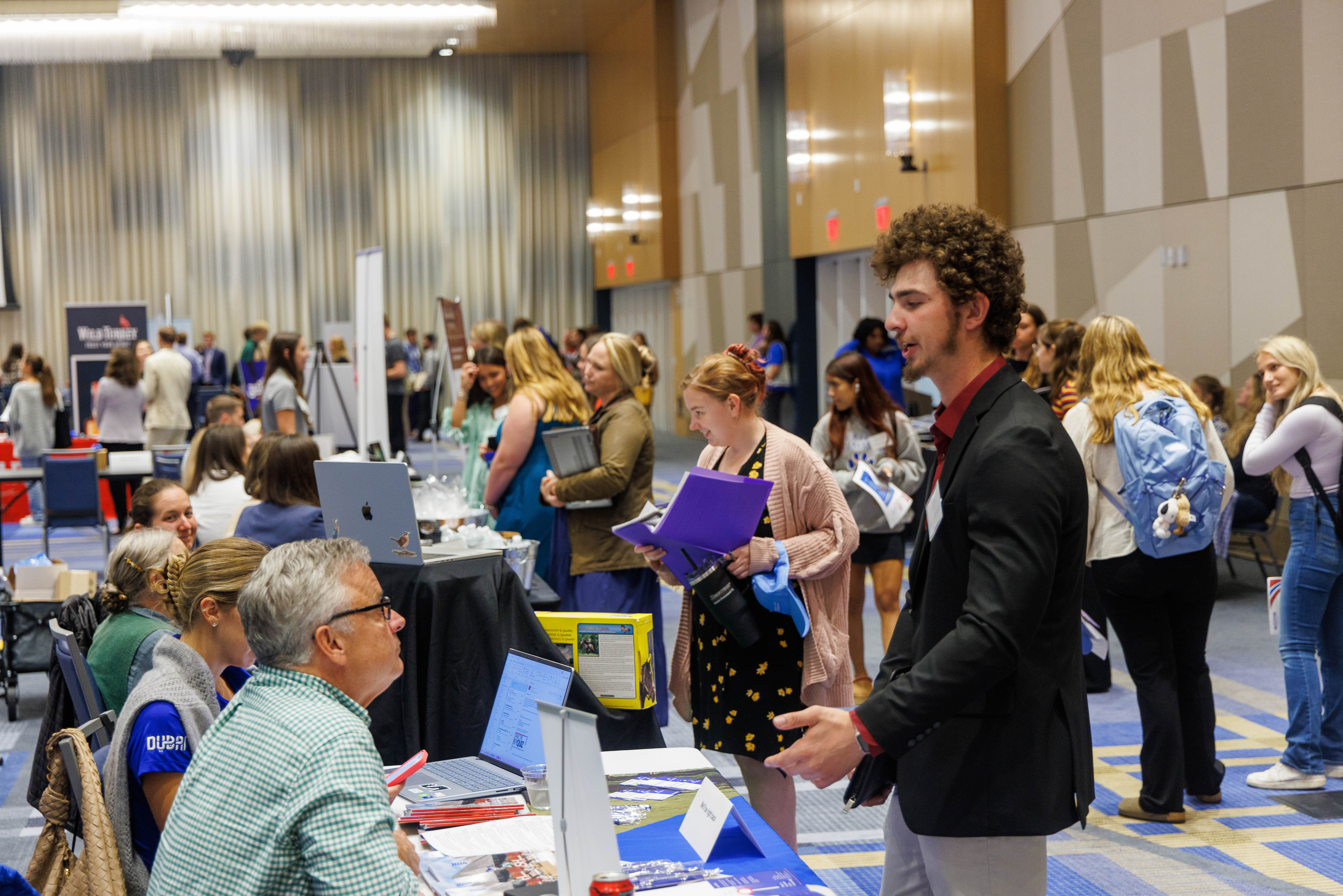 Students engaging with employers at the 2025 Kentucky Signature Industries Career Fair. Photo by Martin-Gatton CAFE.