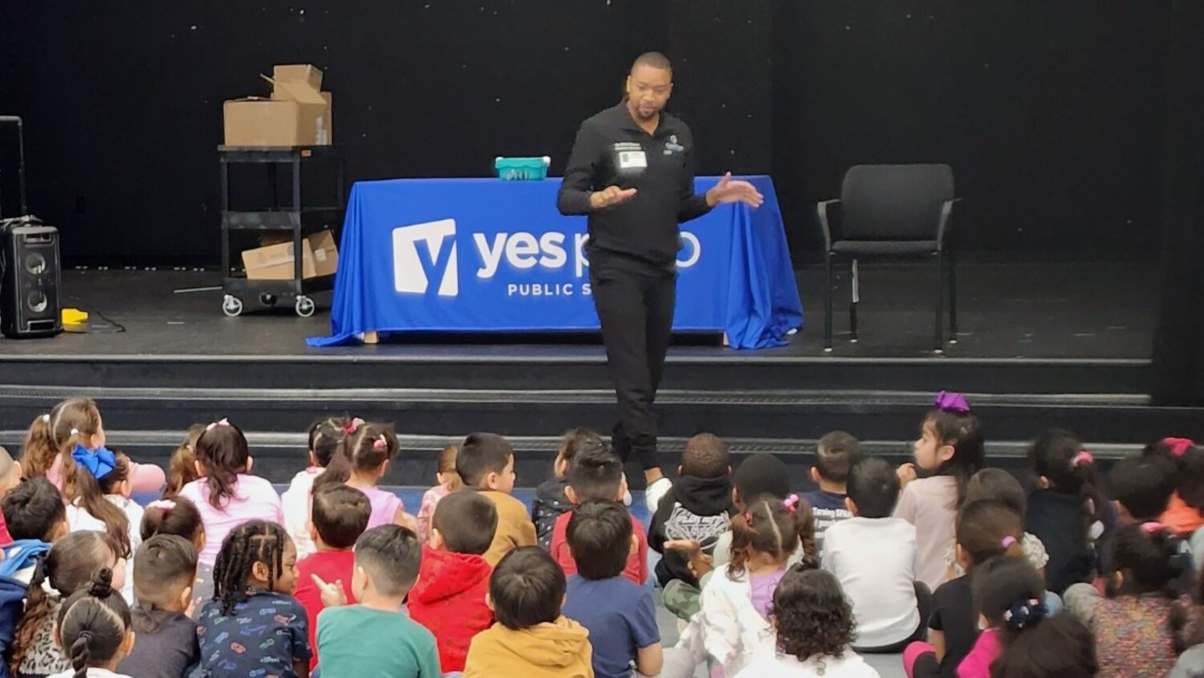 Christopher Chance visits local elementary and middle schools, talking about the importance of a college education. Photo courtesy of Oaks Point Pediatric Dentistry.