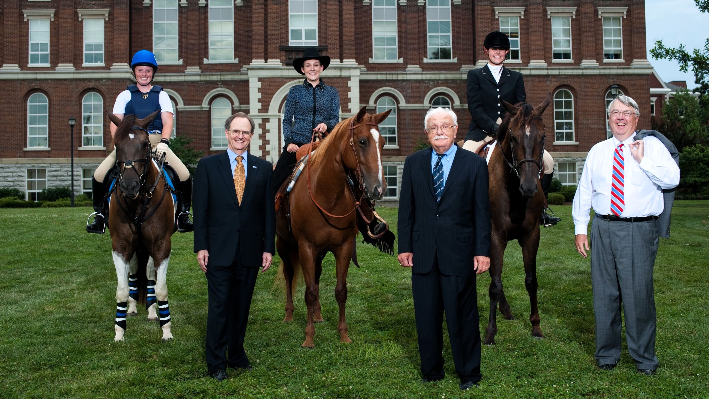 Campus picture to promote the 2010 World Equestrian Games, hosted in Lexington. From left to right in front are President Lee T. Todd, Dr. Michael Karpf and Dean Scott Smith. In the back, pictured on horseback are Courtney Calnan, Krista Lea and Leah Alessandroni.