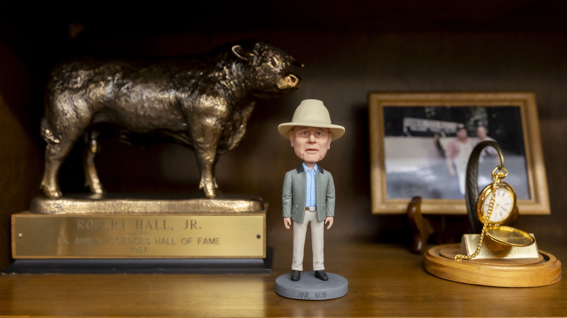 Bob Hall's office at Hallway Feeds includes a history of stories and artifacts, including his "Mr. Bob" bobblehead and UK Animal Sciences Hall of Fame award in 1987. Photo by Sabrina Hounshell.